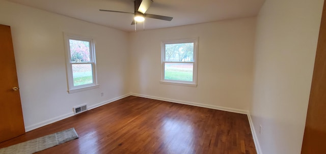 unfurnished room featuring dark hardwood / wood-style floors and ceiling fan