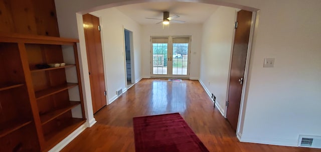 doorway featuring ceiling fan, french doors, lofted ceiling, and hardwood / wood-style flooring