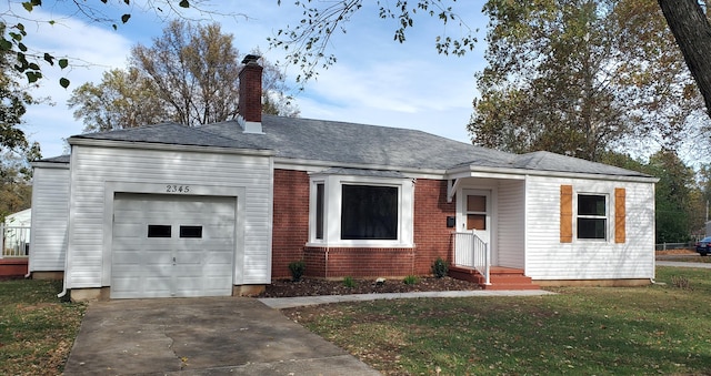 single story home featuring a garage and a front yard