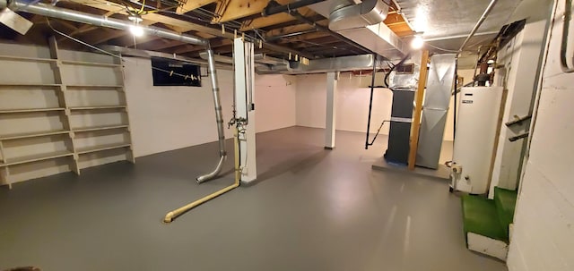 basement featuring heating unit and water heater