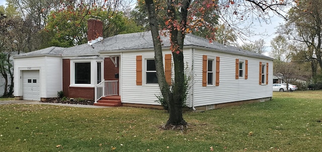 view of front facade with a garage and a front lawn