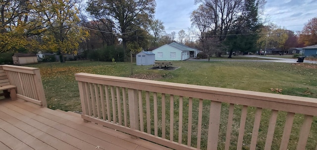 wooden terrace with a yard and a storage shed