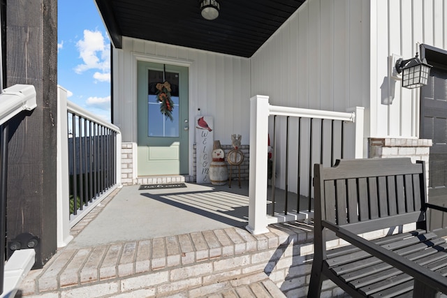 doorway to property featuring covered porch