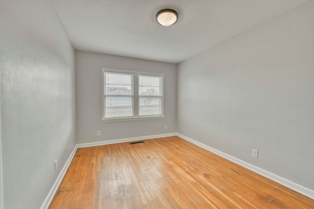 unfurnished room featuring light hardwood / wood-style floors