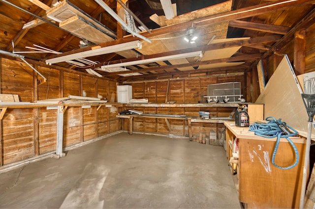 interior space with concrete floors and a workshop area