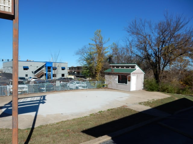 view of patio featuring an outbuilding