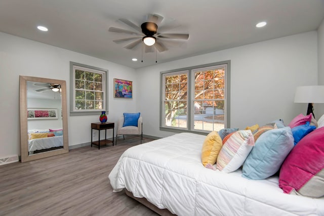 bedroom featuring hardwood / wood-style floors and ceiling fan