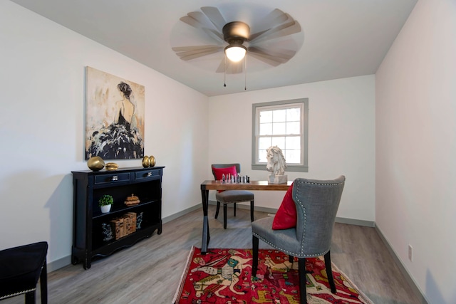 office space with light hardwood / wood-style flooring and ceiling fan