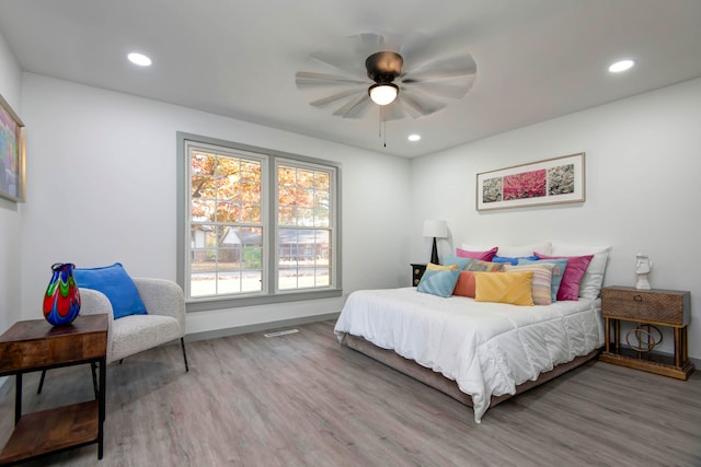 bedroom featuring hardwood / wood-style flooring and ceiling fan