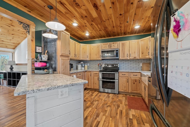 kitchen with light brown cabinets, backsplash, pendant lighting, appliances with stainless steel finishes, and light wood-type flooring