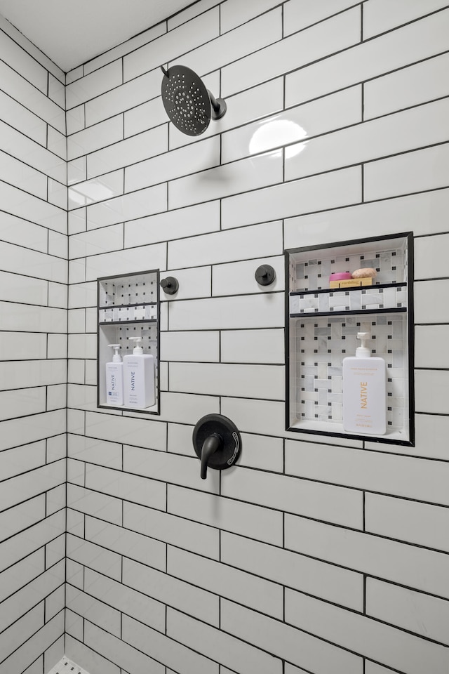 bathroom with tiled shower