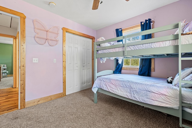 carpeted bedroom featuring ceiling fan and a closet