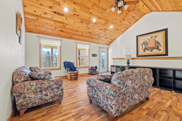 living room with lofted ceiling, ceiling fan, light wood-type flooring, and wood ceiling