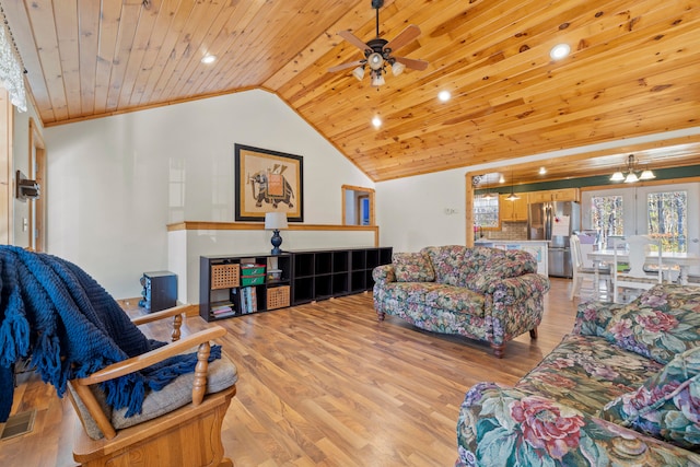 living room with light hardwood / wood-style flooring, crown molding, lofted ceiling, wood ceiling, and ceiling fan with notable chandelier