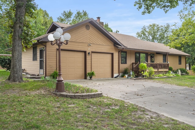 ranch-style house with a front yard and a garage