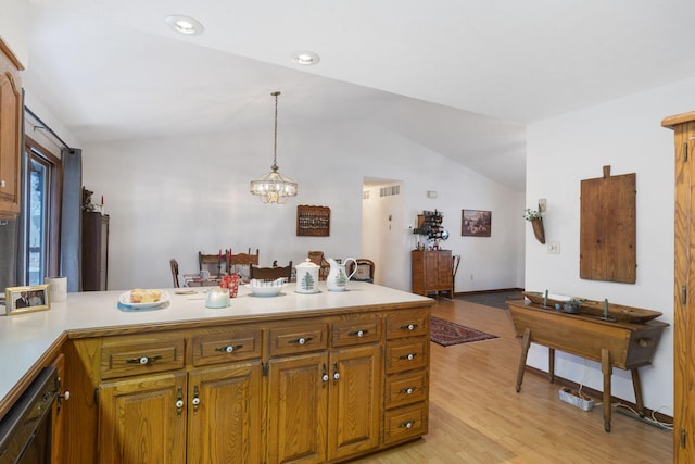 kitchen with dishwasher, hanging light fixtures, light hardwood / wood-style flooring, a chandelier, and lofted ceiling