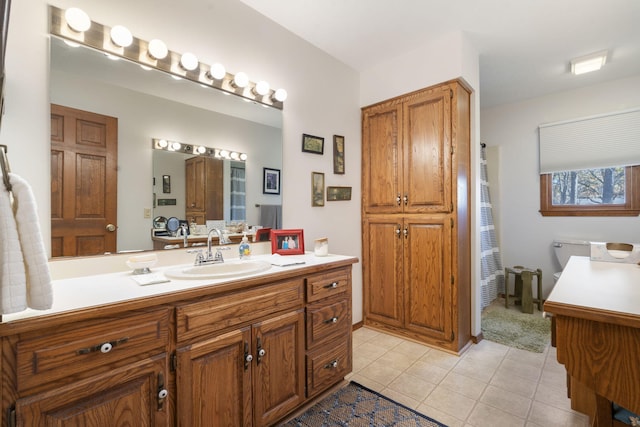 bathroom featuring tile patterned flooring and vanity