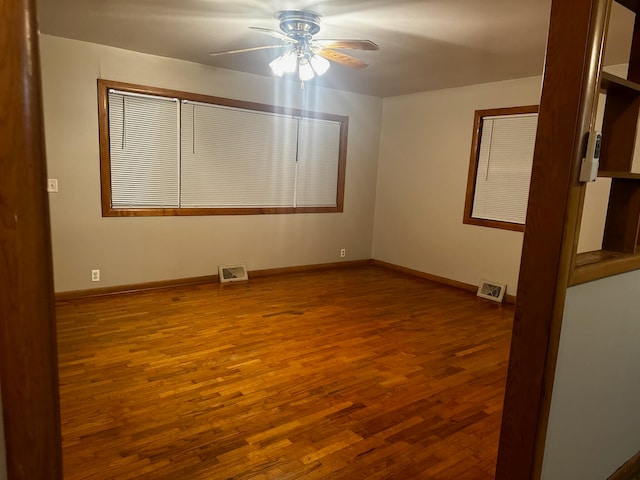 unfurnished room featuring ceiling fan and wood-type flooring