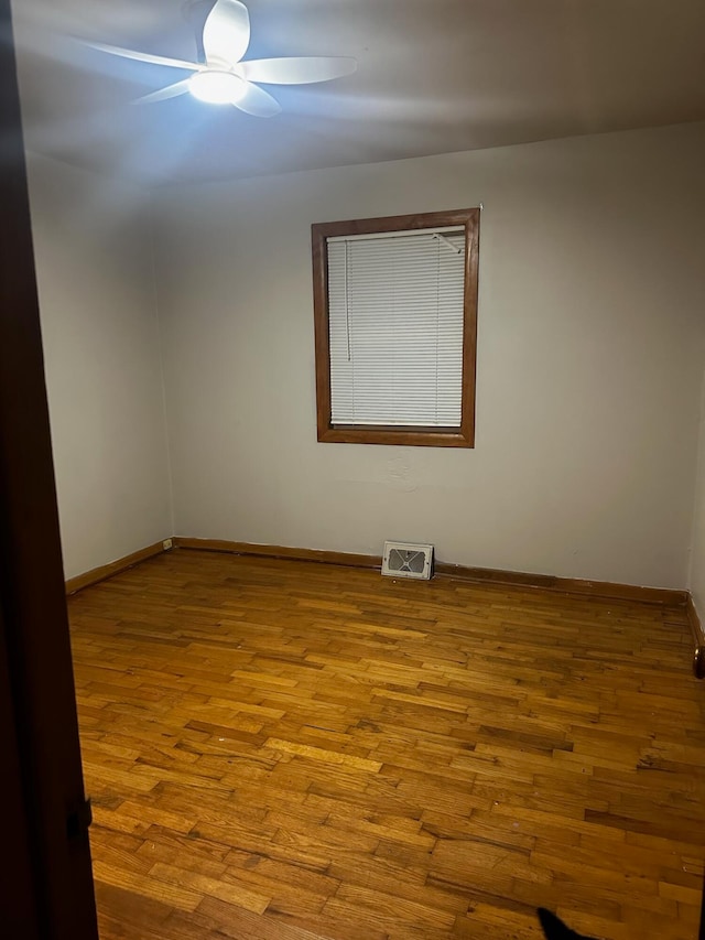 unfurnished room with ceiling fan and light hardwood / wood-style flooring