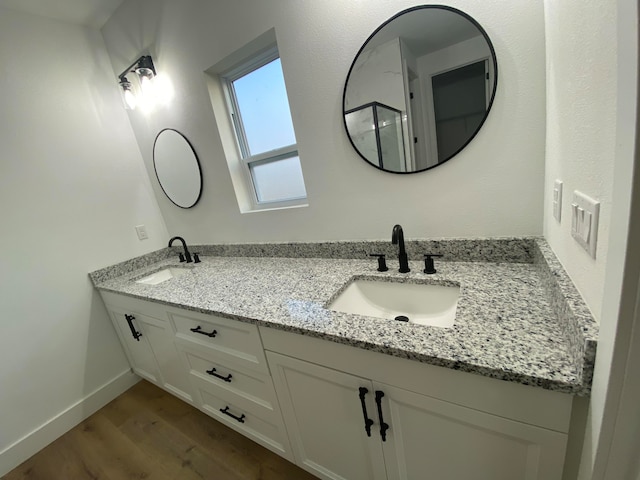 bathroom featuring hardwood / wood-style flooring and vanity