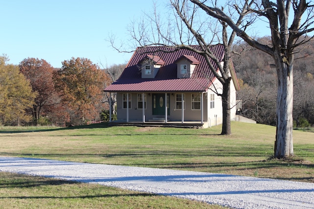 view of front of house featuring a front lawn and covered porch