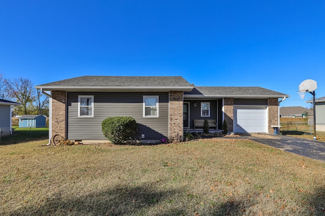 view of front of home with a front yard and a garage