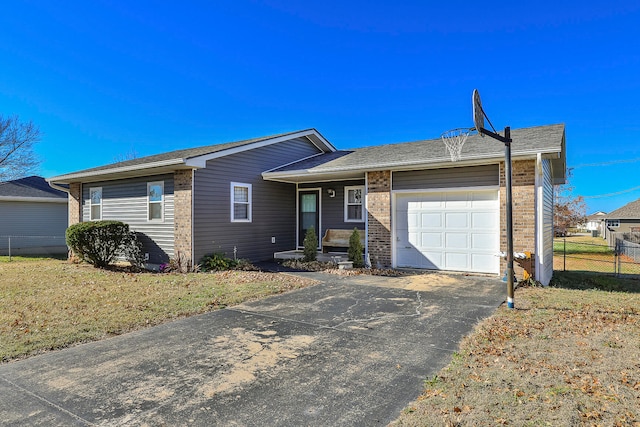 ranch-style home with a front yard and a garage