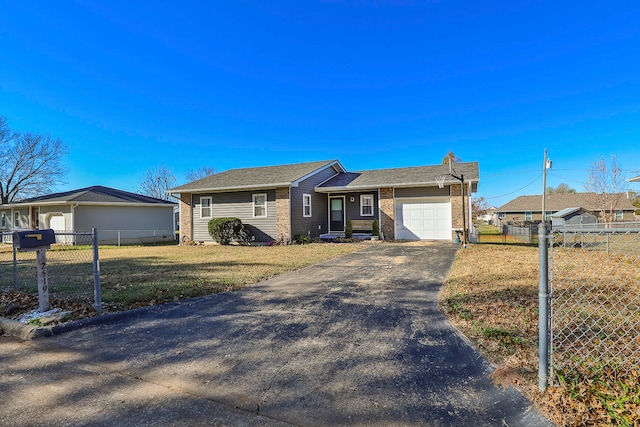 single story home with a garage and a front yard