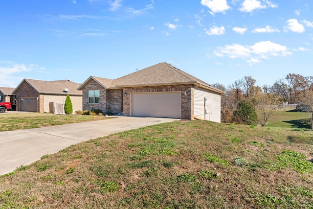 ranch-style home featuring a front yard and a garage