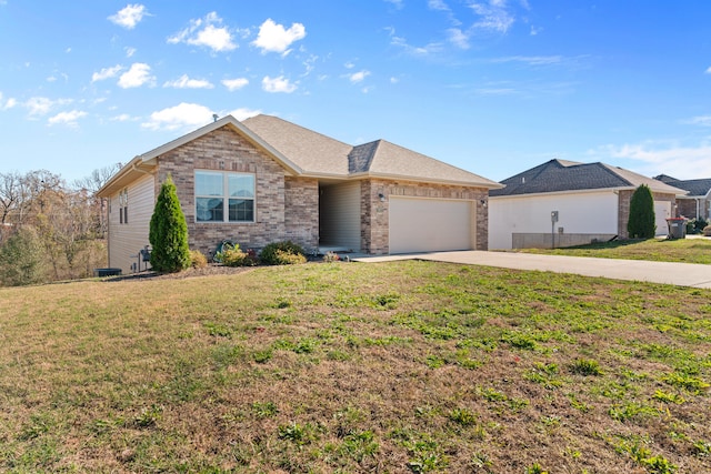 single story home with a front yard and a garage