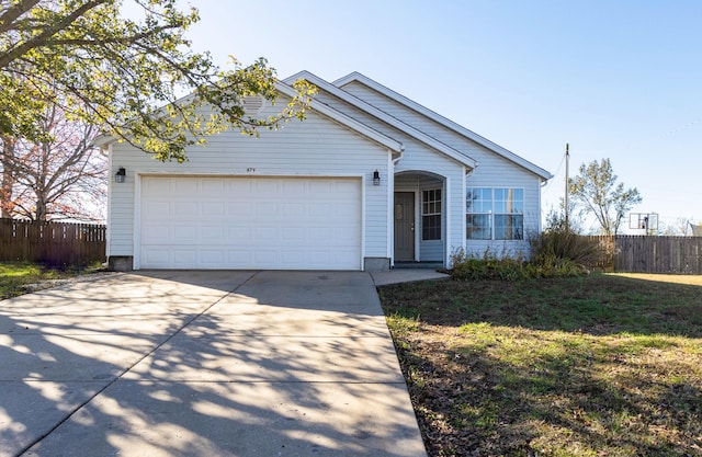 ranch-style house with a front yard and a garage