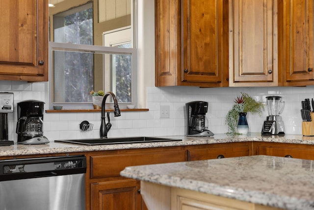 290 Deep Frst Unit 58, Hollister, MO 65672 - kitchen with dishwasher, brown cabinets, backsplash, and light stone countertops