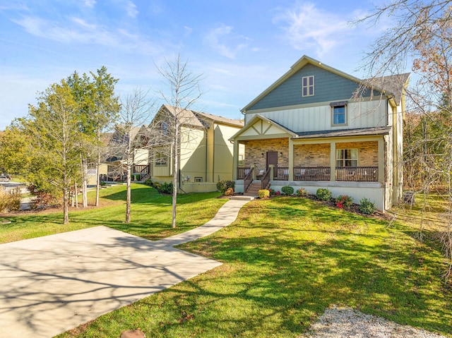 view of front of property featuring covered porch and a front lawn