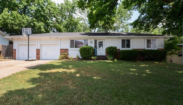 ranch-style home featuring a garage and a front lawn