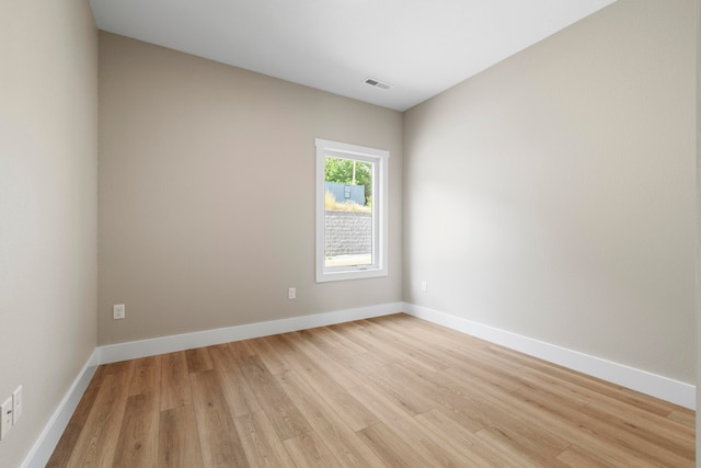 unfurnished room featuring light wood-type flooring