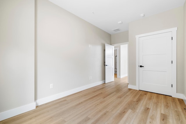 empty room with light wood-type flooring