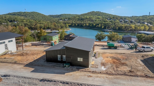 drone / aerial view with a water and mountain view