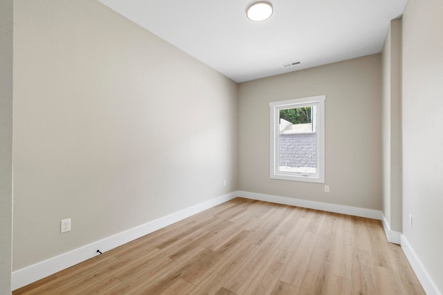 spare room featuring light hardwood / wood-style floors