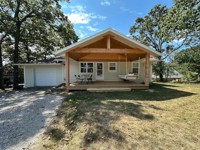 view of front of house featuring a garage and a front lawn