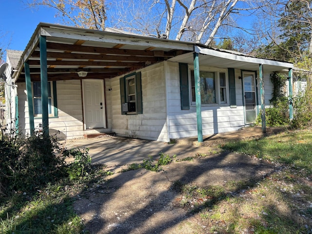 view of front of property with a carport