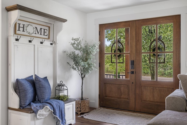 entryway with french doors and wood-type flooring