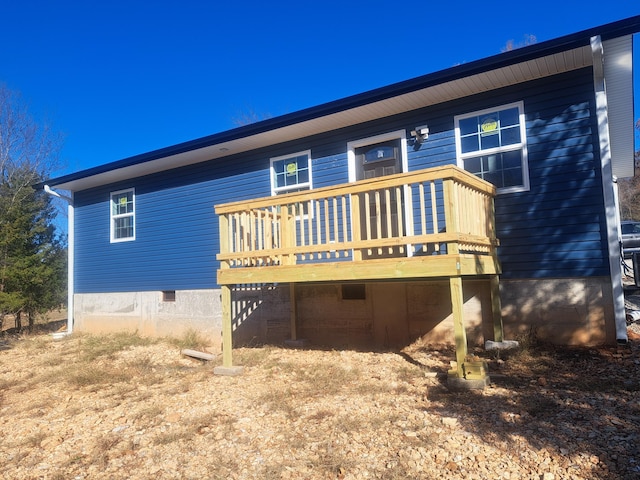 back of house with a wooden deck