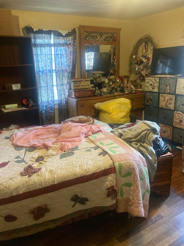 bedroom with wood-type flooring