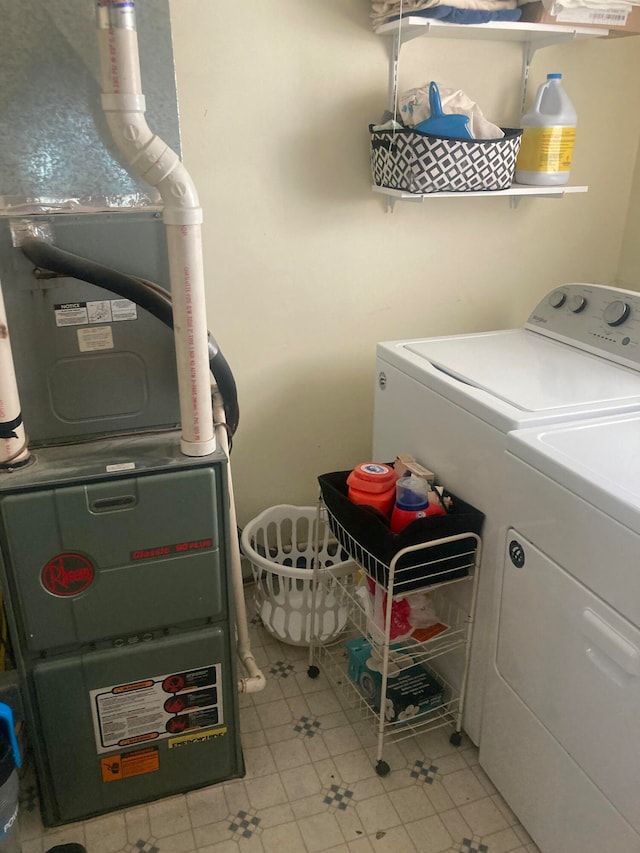 clothes washing area featuring washer and clothes dryer