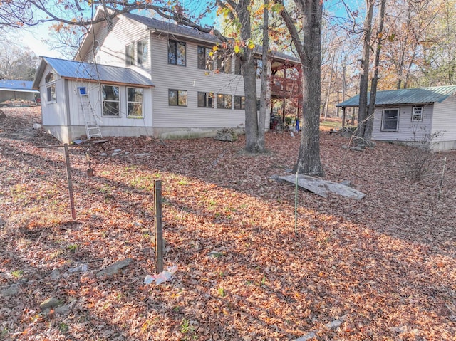 view of side of property featuring an outbuilding