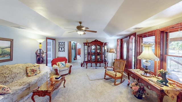 carpeted living room featuring ceiling fan