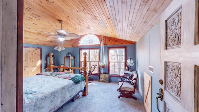 carpeted bedroom featuring ceiling fan, wooden ceiling, and vaulted ceiling