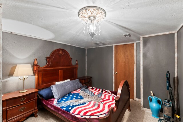 carpeted bedroom with a textured ceiling