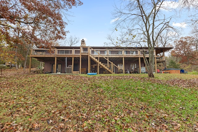 rear view of house featuring a deck