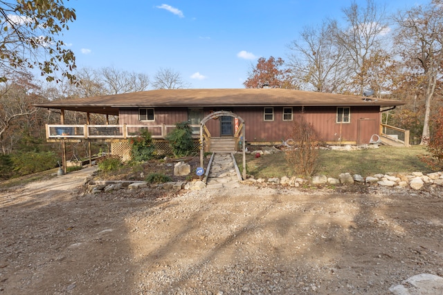 view of front of home with a wooden deck